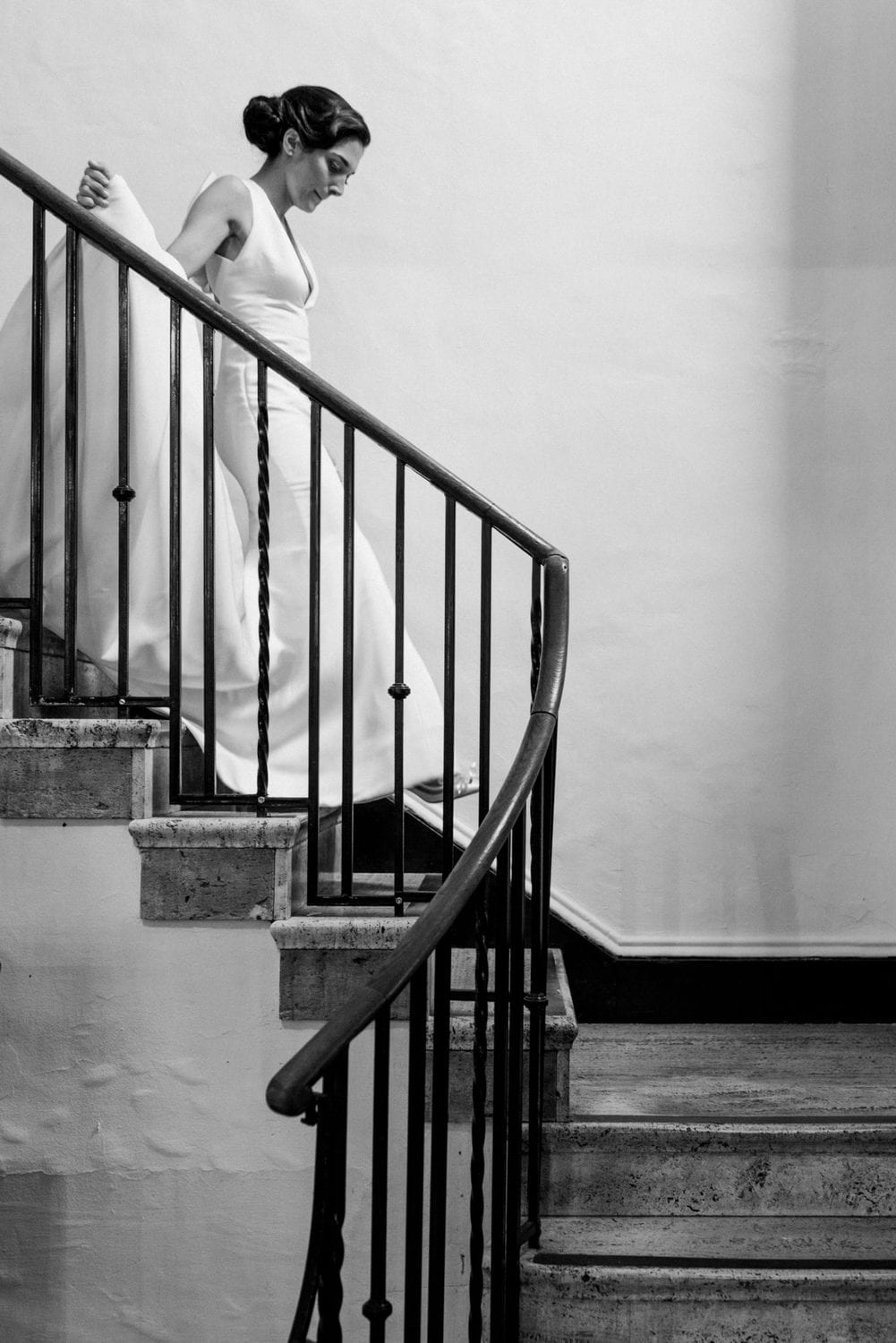 Bride in Marchesa Gown walking down staircase, Thayer Hotel